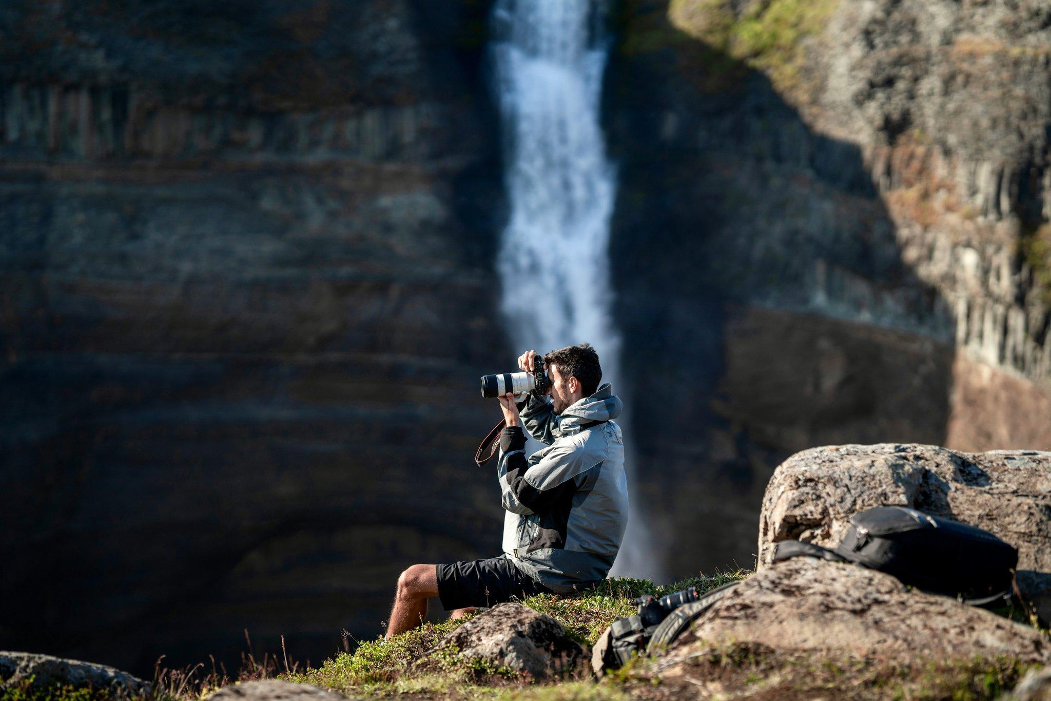 Sarah smiling next to a scenic overlook captured using her discounted GoPro camera.