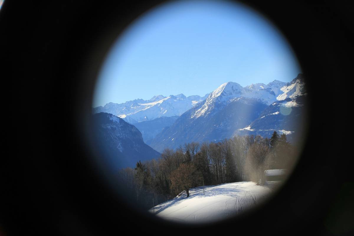 Why Your Hiking Photos Suck (And How a Wide Aperture Nature Lens Fixes Everything)