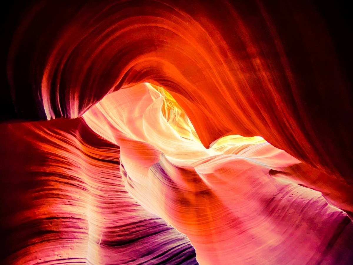 a very colorful rock formation with a bright light coming from it