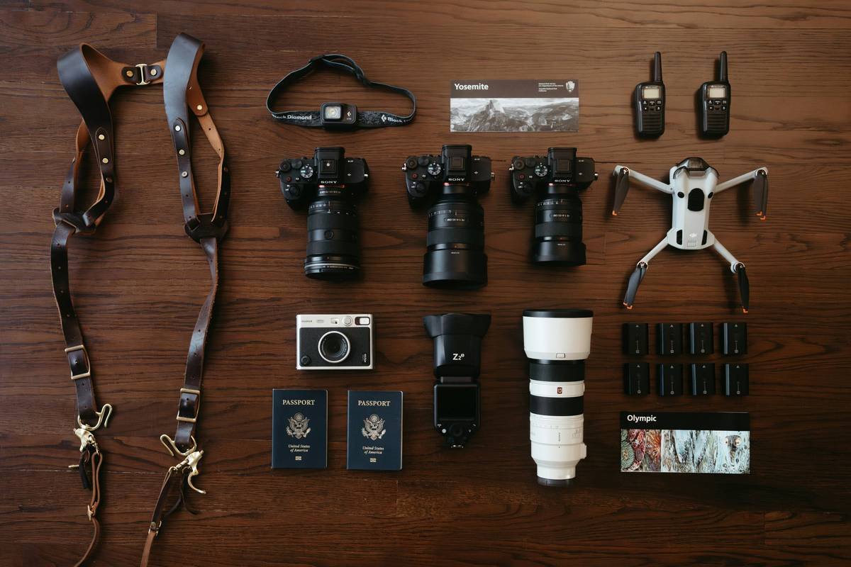 Side-by-side comparison of popular hiking cameras showing weights in grams: GoPro HERO12 (154g), Insta360 Ace Pro (198g), DJI Osmo Action 4 (157g), Sony ZV-1 II (343g), iPhone 15 Pro (187g)