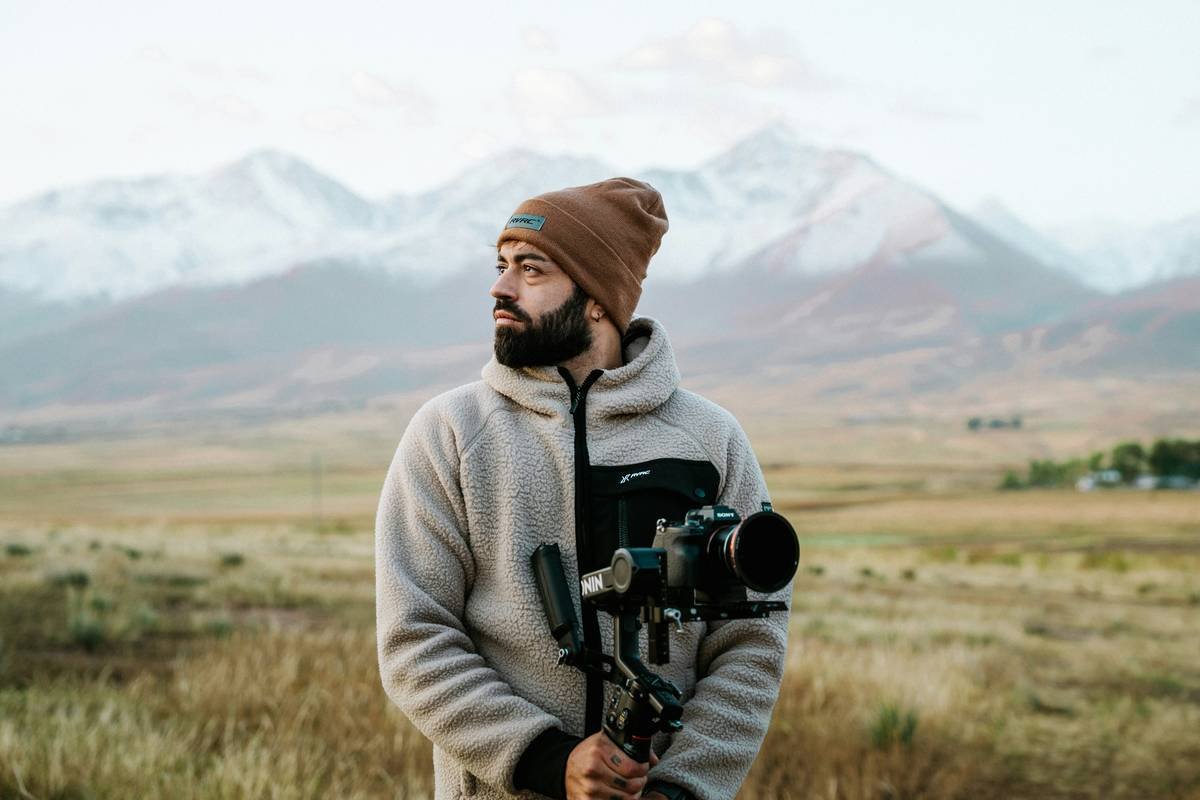 Side-by-side comparison of premium outdoor cameras in rugged mountain terrain